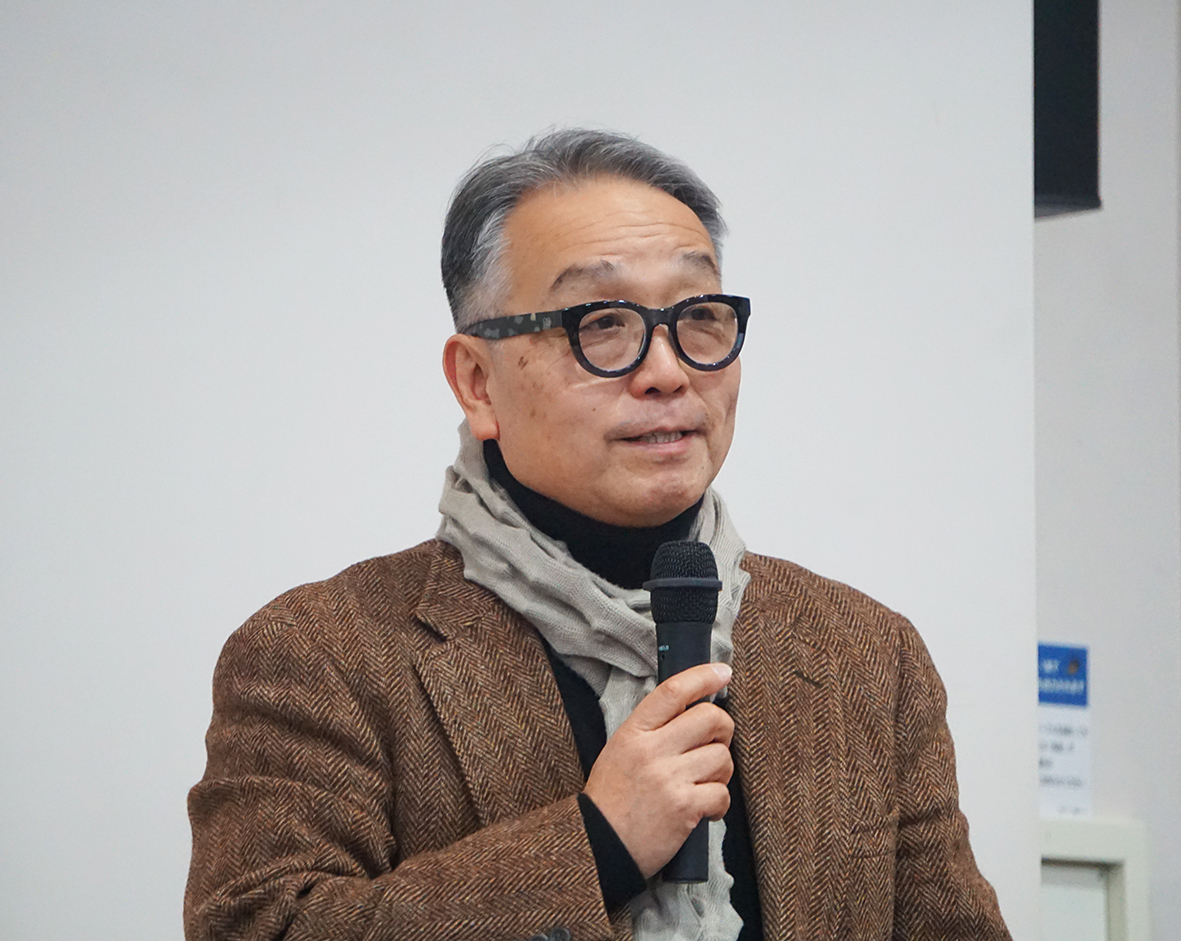 （画像：「希望のまち」の計画について語る奥田理事長）